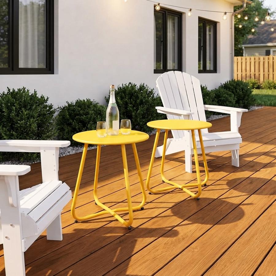 Round metal side tables levelled on a weathered wooden deck